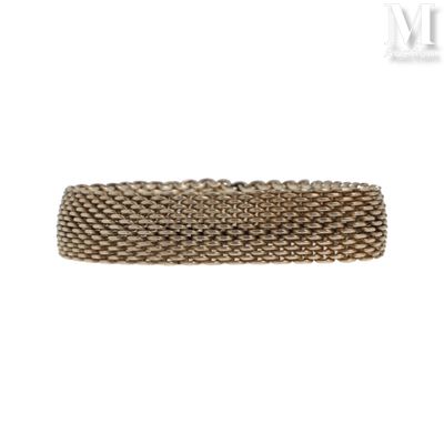 a close up of a bracelet on a white background
