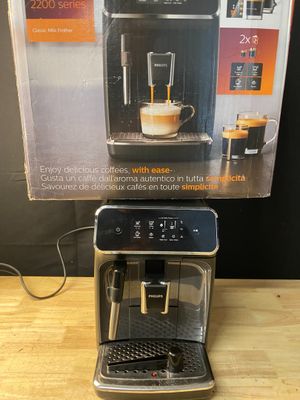 an image of a coffee machine sitting on top of a wooden table