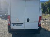 a picture of a white van parked in a parking lot