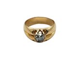a close up of a gold ring with a stone in the middle