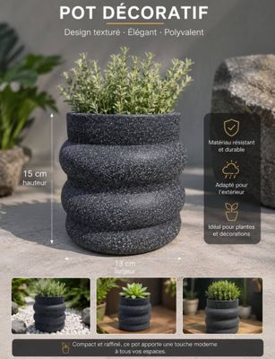 a close up of a pot with plants in it on a table