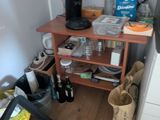 a small kitchen with a coffee maker on a small table