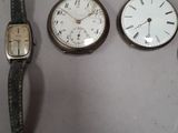 several different types of watches are displayed on a white surface