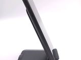 a cell phone that is sitting on top of a stand