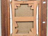 an old picture frame with a piece of wood in the middle of it