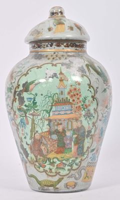 a vase with a lid that has a picture on it