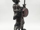 statue of a man with a sword and shield on a white background