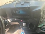 a picture of a car dashboard with a blue light on