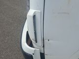 a close up of a white truck with the door open