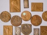 some of the medals are displayed on a white surface