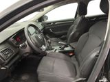 the interior of a car with a steering wheel and dashboard controls