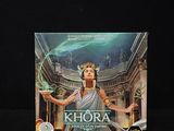 an image of a card game box with a picture of a woman holding a sword