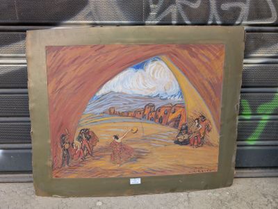 une photo d'un tableau représentant un paysage désertique accroché au mur
