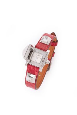 a close up of a wrist watch with a red leather band