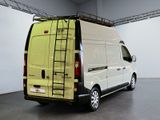 a white van with a ladder on the back of it