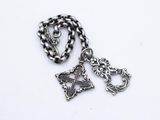 a close up of a chain with a cross and a cross on it