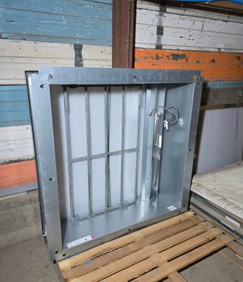 an image of a metal enclosure in a warehouse
