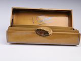 a gold box with a picture of a cat inside of it