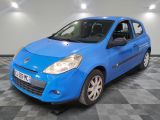 the small blue car is parked in the garage on a checkered floor