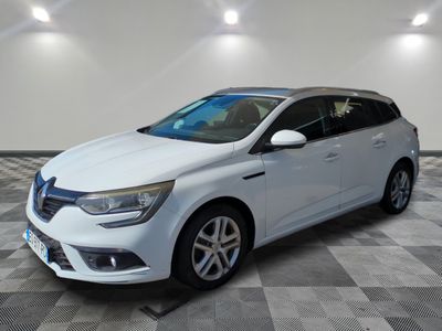 the white car is parked in a large room with a checkered floor