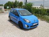 a blue car that is parked in a parking lot