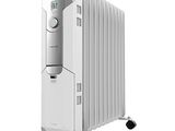 an image of a white electric heater sitting on top of a white table