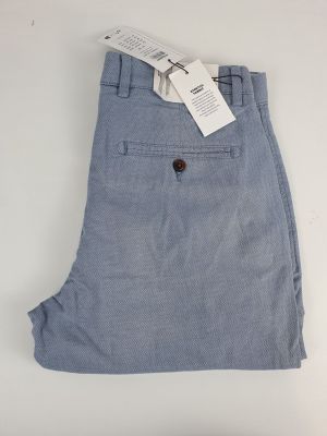 a close up of a pair of blue pants on a white surface