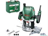 a green and black electric router with tools on a white background