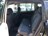 the back seat of a car with the door open in a parking lot