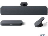 an image of a set of speakers and a remote on a white surface