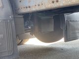 a close up view of a truck ' s tire with a lot of rust