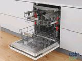 a dishwasher in the middle of a kitchen counter