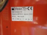 a label on the side of a machine that is sitting on a table