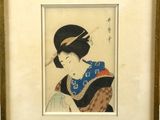 an old picture of a woman in a kimono dress smoking a cigarette