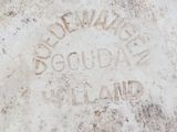a close up of a sign on a cement surface