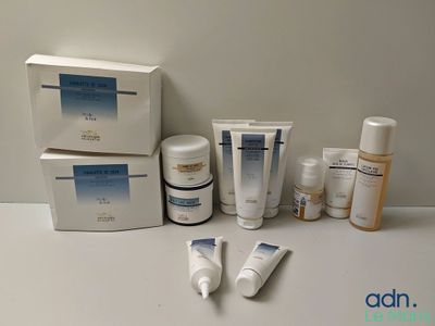 many different types of skin care products sitting on a table