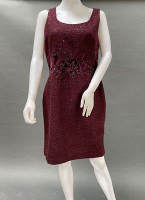 an image of a mannequin dressed in a red dress