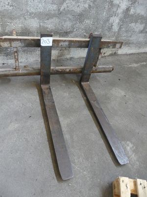 two forks that are sitting on a pallet