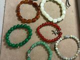 a box of assorted bracelets with a tag on it