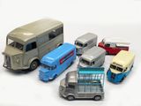 a lot of toy cars that are on a white surface