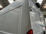 a white van that is parked inside of a building