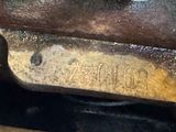 a close up of a piece of metal with a number on it