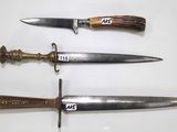 three different types of knives on display on a table
