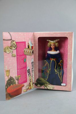 doll in a pink box with a picture of a woman in a blue dress