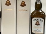 three bottles of liquor sitting next to each other on a table