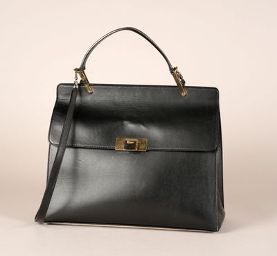 a black leather handbag with gold hardware