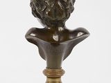 an antique bronze bust of a woman on a marble base