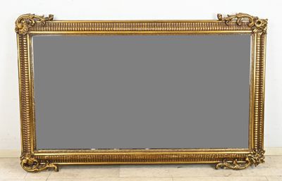 large antique gold framed mirror with ornate scrolls and scrolls