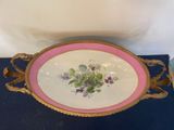 a plate with flowers on it sitting on a table