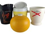 three cups and a jug sitting next to each other